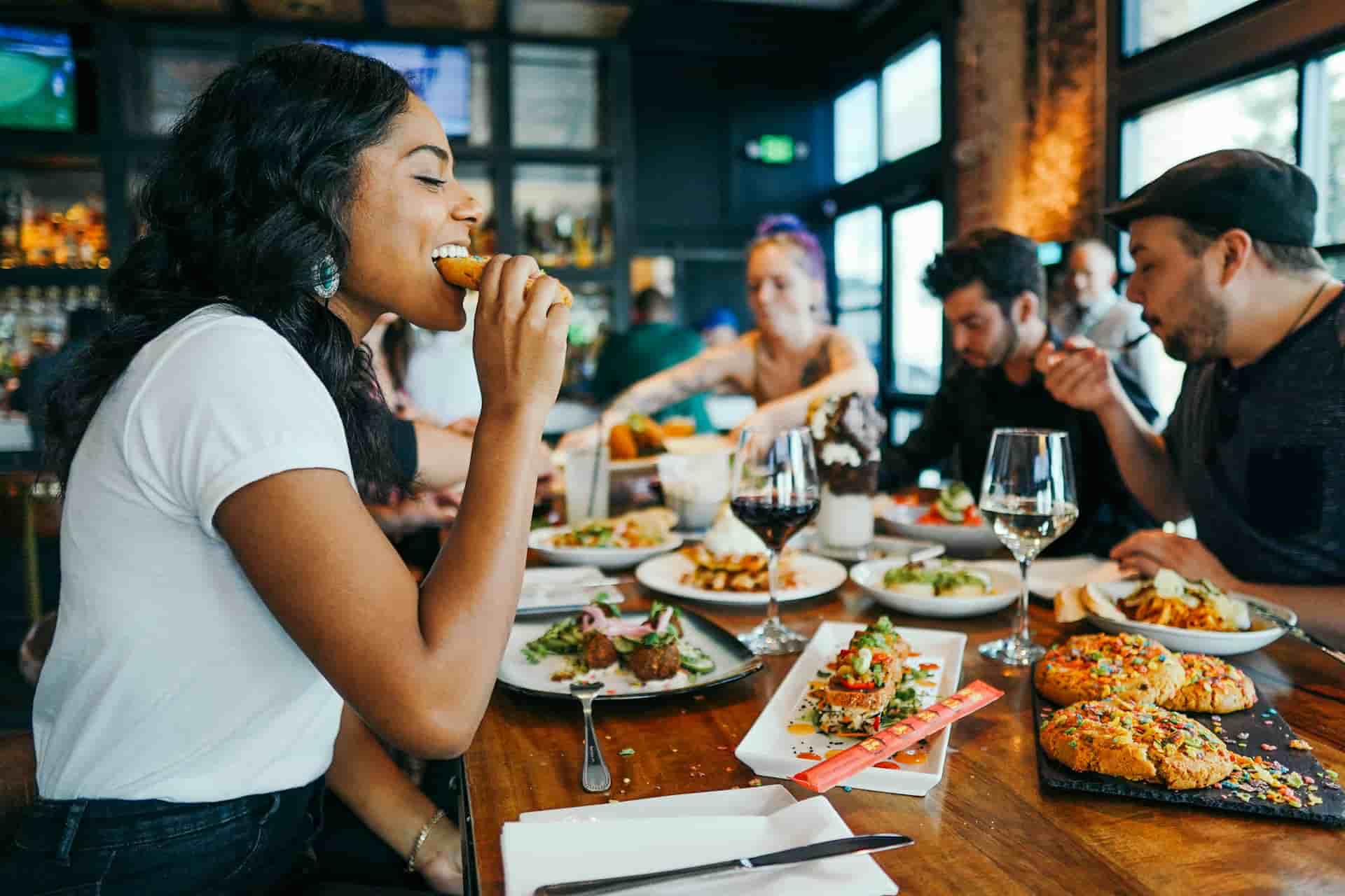 Guests enjoying food together in a restaurant