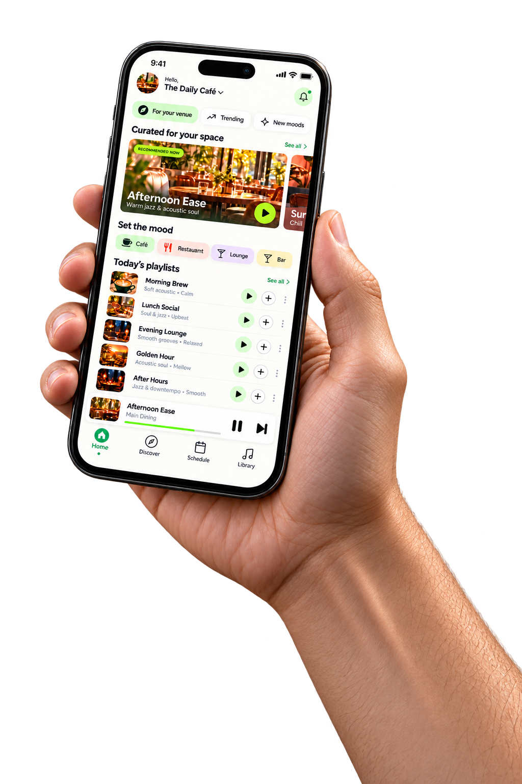 Hand holding a phone displaying the café music app
