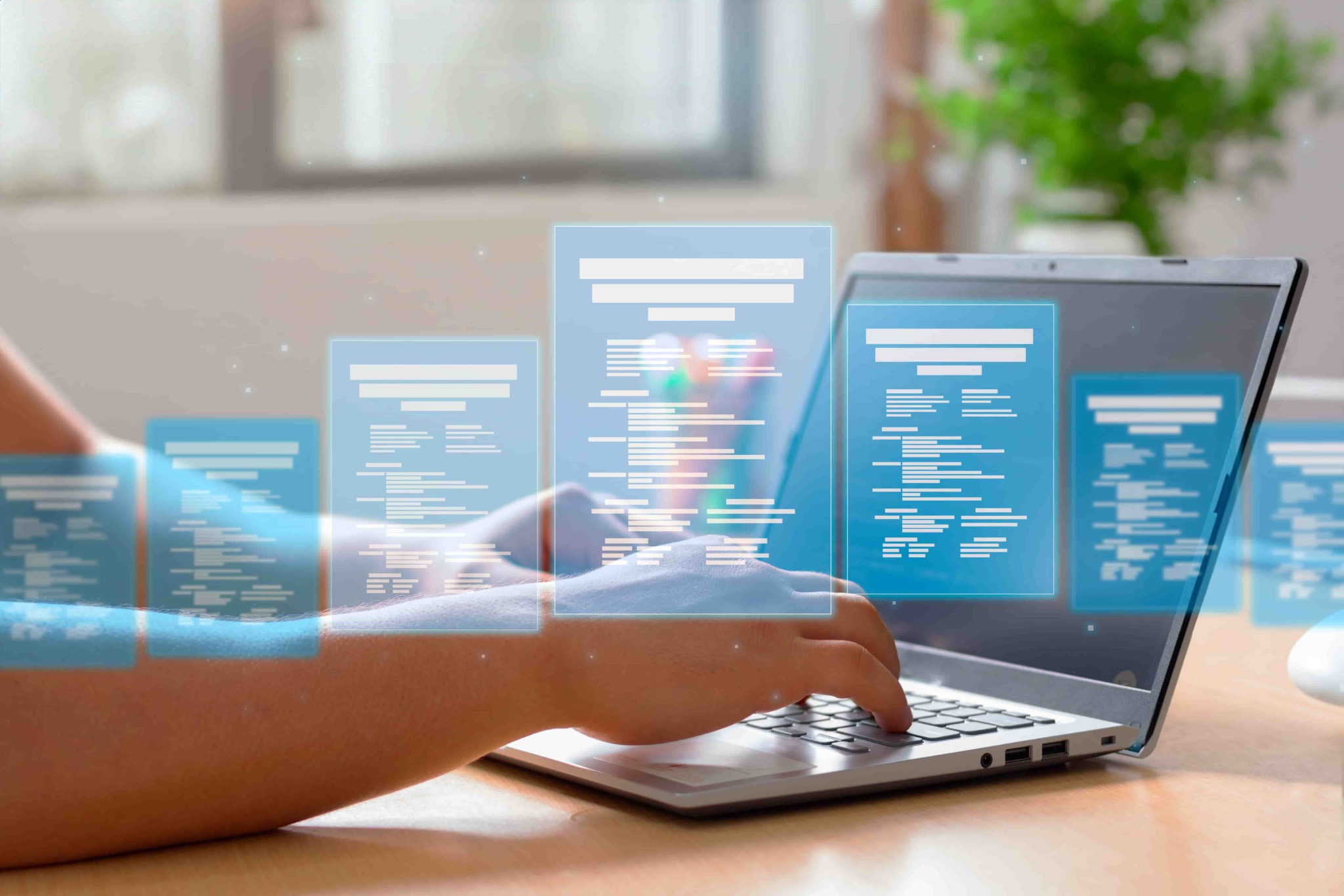 Digital document management forms displayed over a laptop
