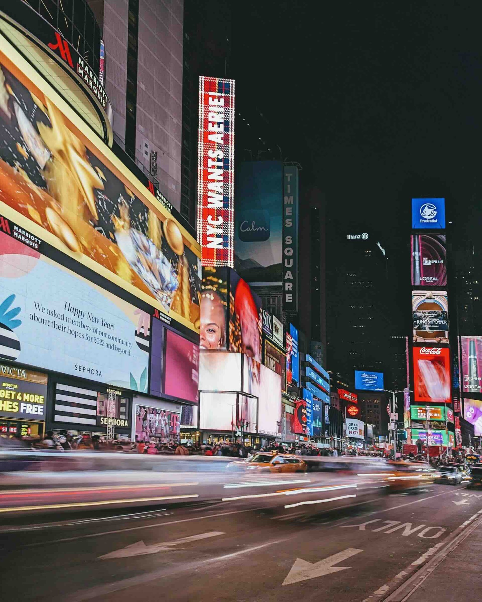 Traffic passing illuminated billboards in Times Square